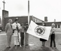 Raising Bicentennial flag
